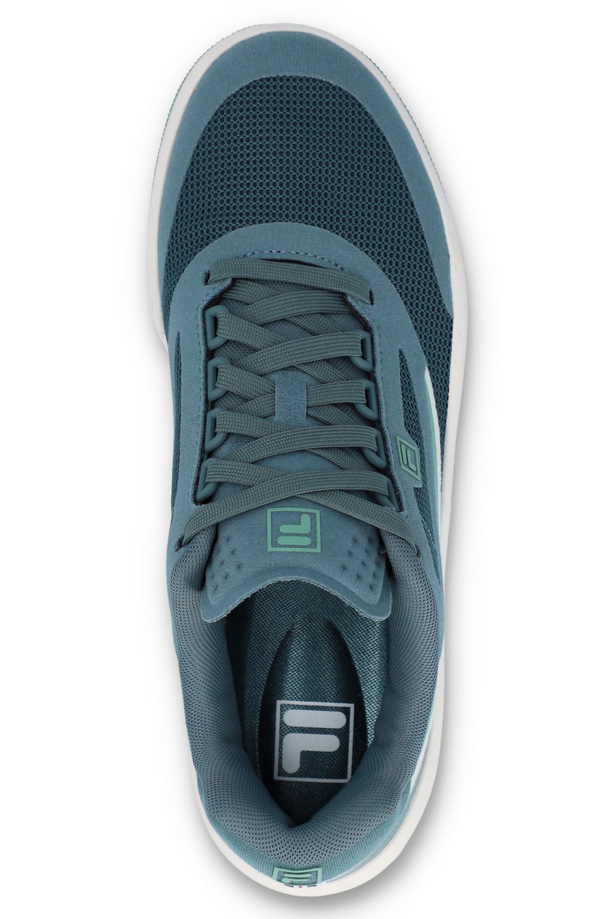 A pair of FILA FX-25 FILA TRAINER sneakers with a low-top design, primarily in green and blue colour tones, featuring the FILA logo on the side.