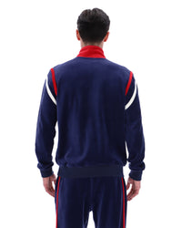 Person wearing a navy tracksuit with red and white accents on a white background