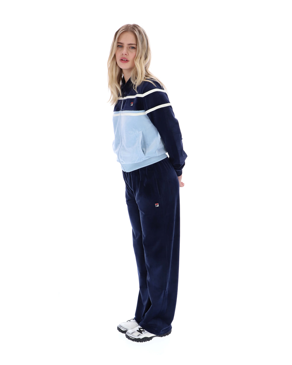 Woman wearing a tracksuit with a white background