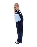 Woman wearing a tracksuit with a white background