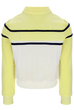 Yellow and white jacket with black trim on a white background