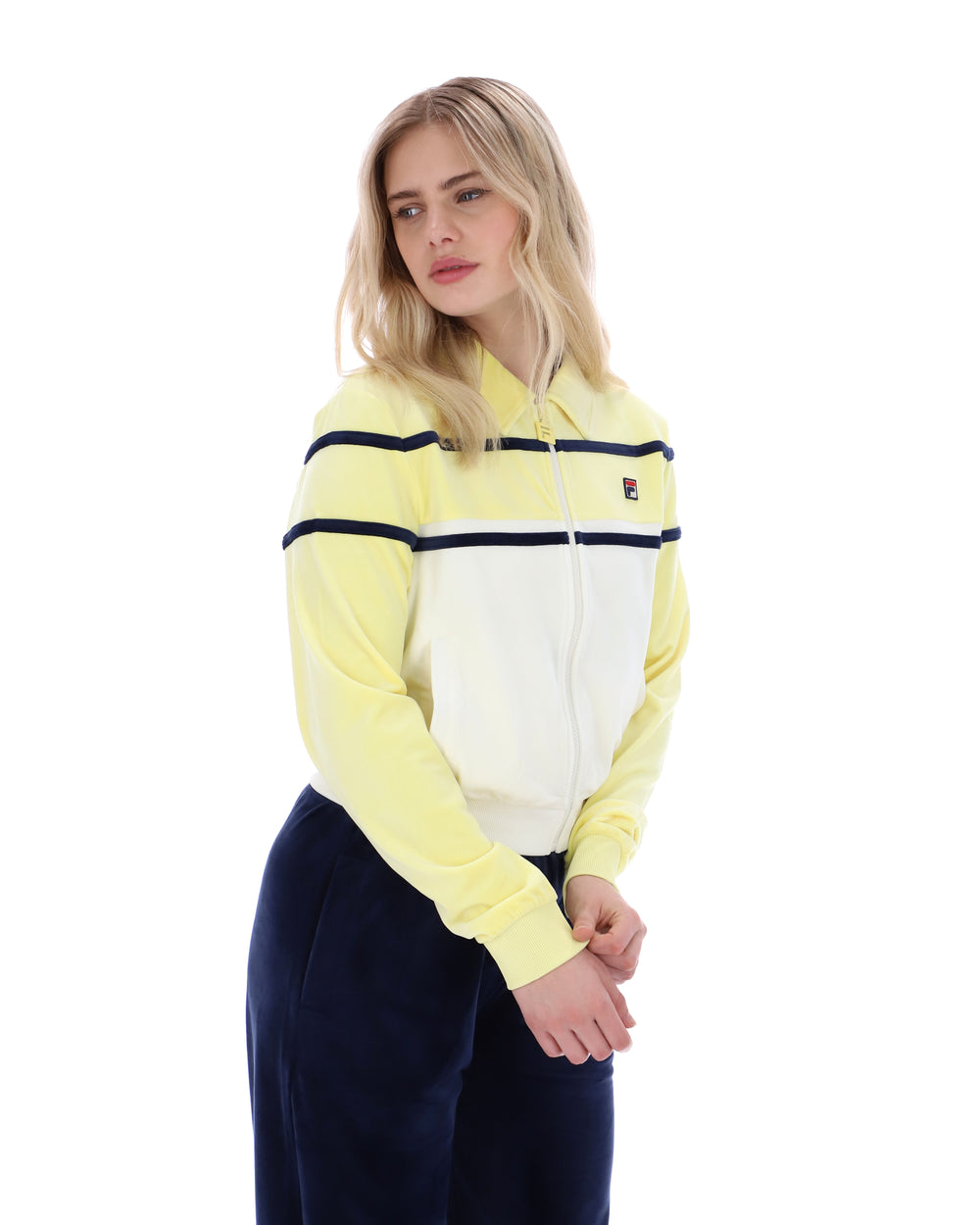 Woman wearing a yellow and white striped sweater with a logo on a white background