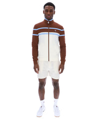 Displays a model wearing the Gardenia 'FILA' branded Giovanni Contrast Panels Track Top