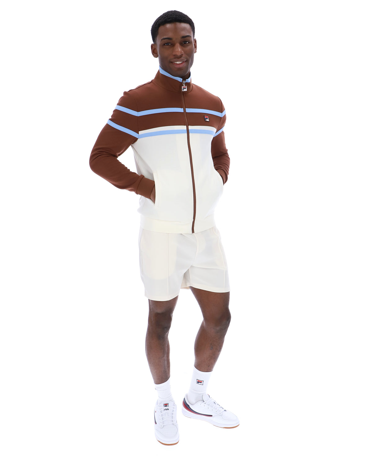 Displays a model wearing the Gardenia 'FILA' branded Giovanni Contrast Panels Track Top