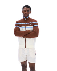 Displays a model wearing the Gardenia 'FILA' branded Giovanni Contrast Panels Track Top
