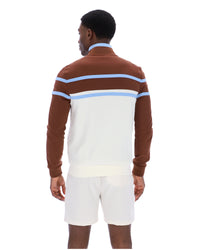 Displays a model wearing the Gardenia 'FILA' branded Giovanni Contrast Panels Track Top