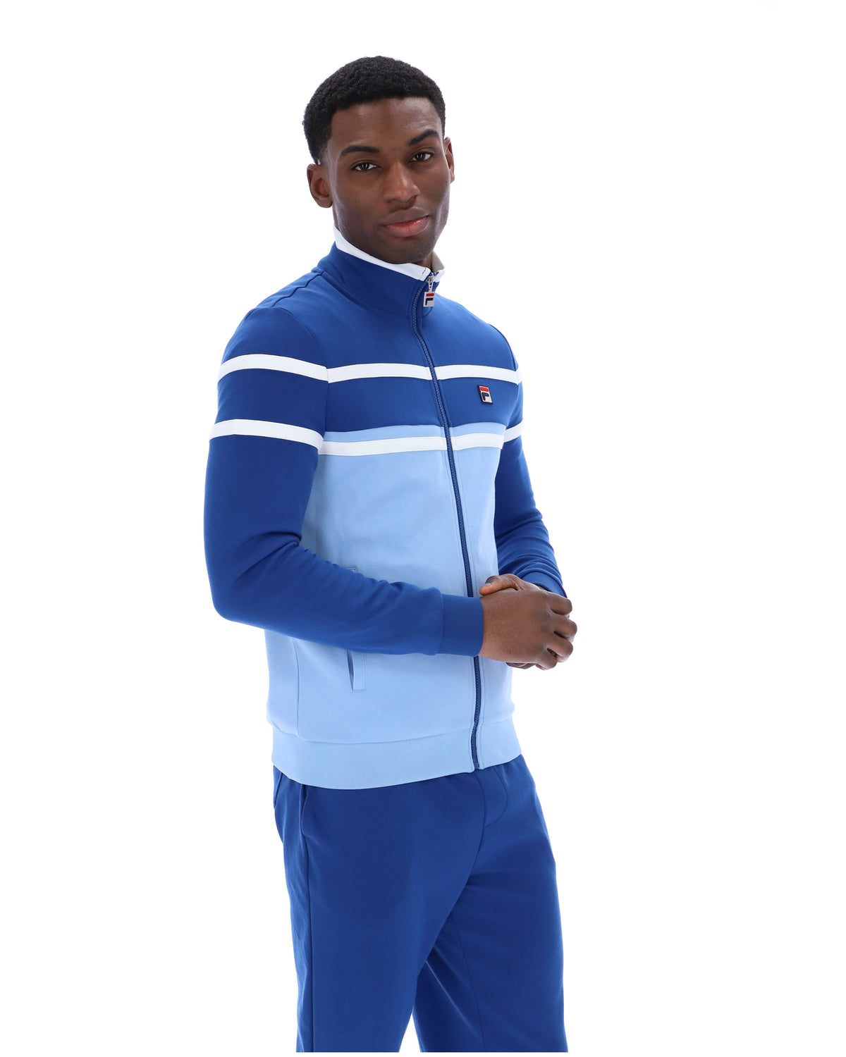 Displays a model wearing the Frozen Fjord 'FILA' branded Giovanni Contrast Panels Track Top