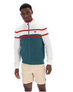 Man wearing a green and white track top with red detailing, with a FILA logo on the chest, paired with beige FILA shorts, against a white background
