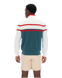Person wearing a colorful striped sweater with a white background