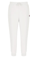 White jogger pants with a small FILA logo on a white background