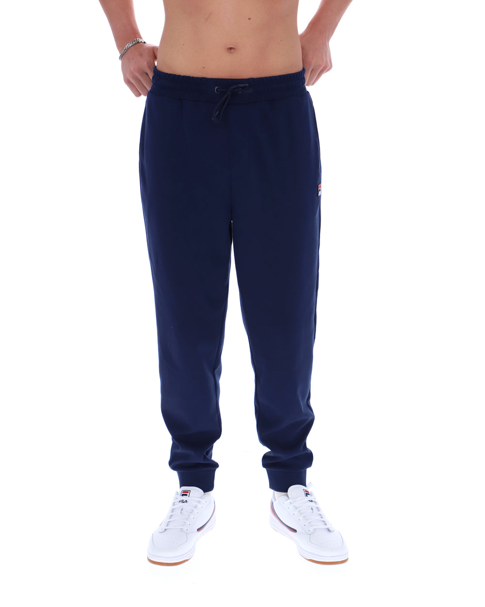 Navy blue sweatpants worn by a person on a white background