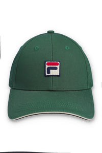 A green baseball cap featuring the Fila logo patch on the front, set against a plain white background.