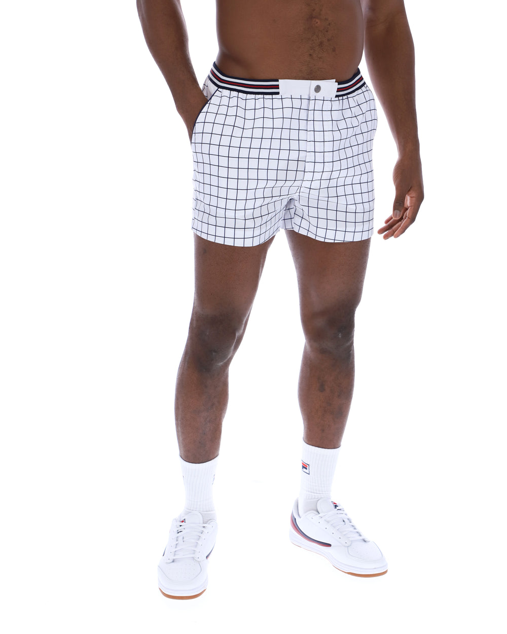 Person wearing white checkered shorts on a white background