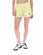 Person wearing yellow athletic shorts with a brand logo on a white background