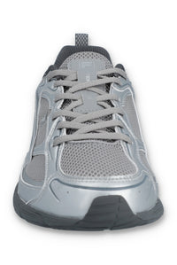 Gray athletic shoe with black sole on a white background