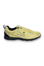 Yellow athletic shoe with black accents on a white background