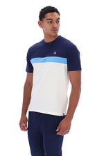 A man wearing a color-blocked short-sleeve t-shirt by FILA in navy blue, white, and light blue, paired with navy pants, against a plain white background.