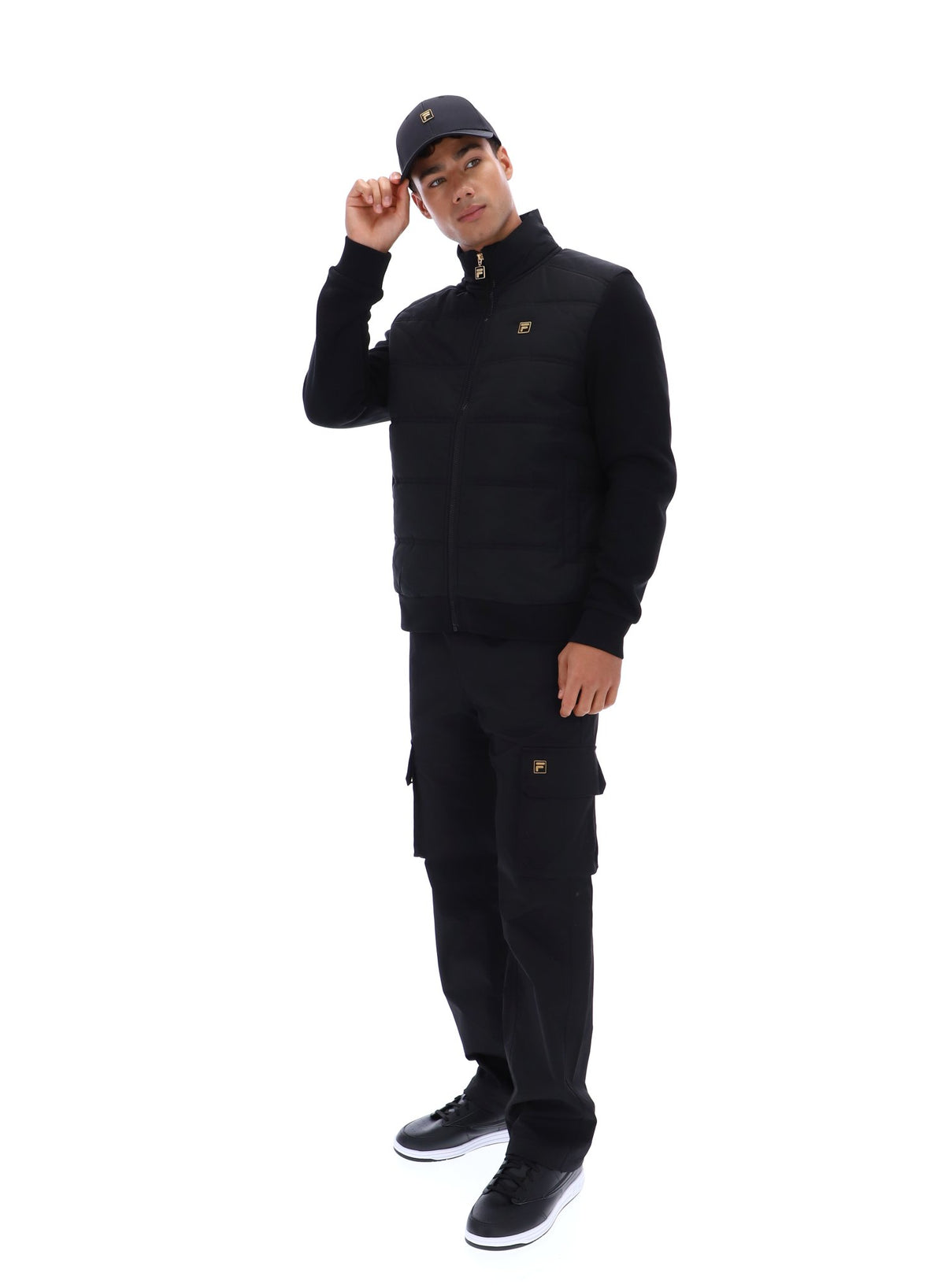 Displays a model wearing the Black 'FILA' branded Jerry Full Zip Padded Jacket
