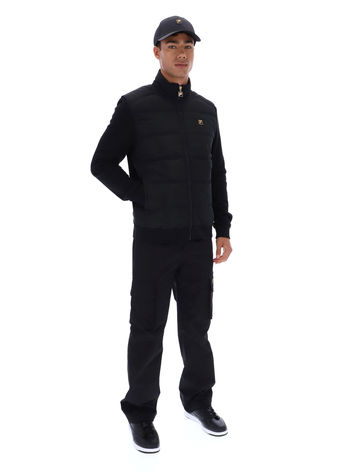 Displays a model wearing the Black 'FILA' branded Jerry Full Zip Padded Jacket