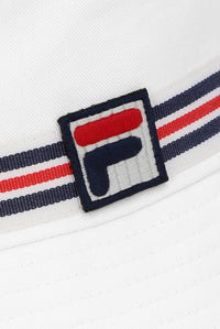 A white bucket hat with a red, blue, and white striped detail around the base and the FILA logo on the front.