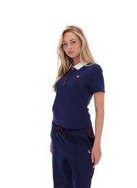 Displays a model wearing the Navy 'FILA' branded Juno Fitted Iconic Polo