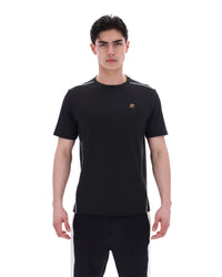 Man wearing a black t-shirt with a logo on a white background