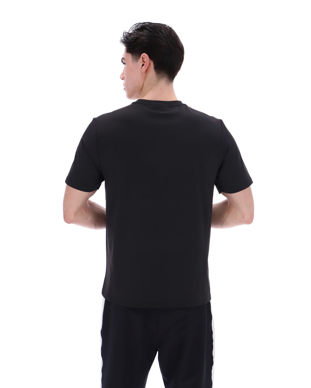 Person wearing a black t-shirt on a white background
