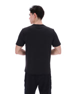 Person wearing a black t-shirt on a white background