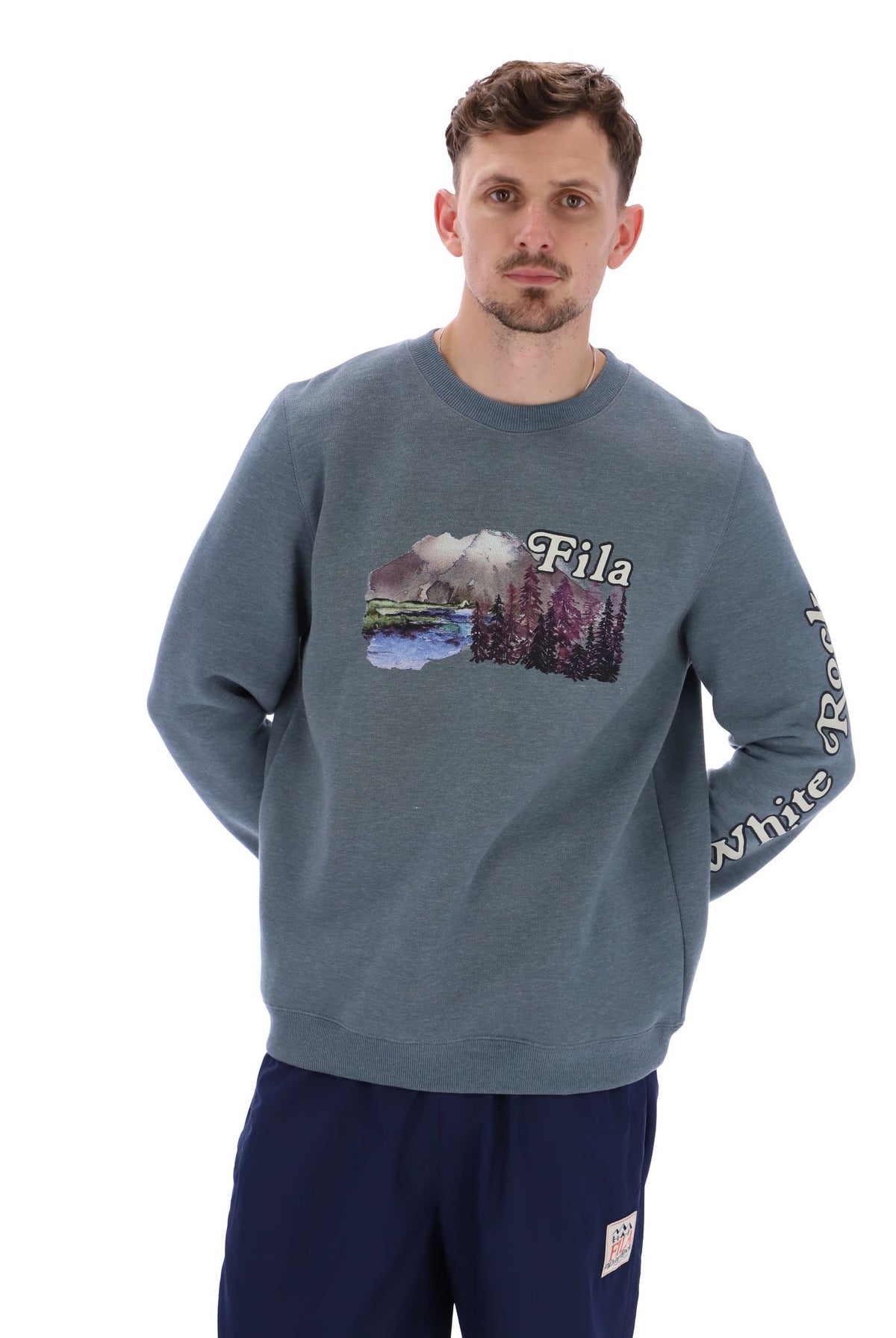 Displays a model wearing the Stormy Weather 'FILA' branded Len Graphic Crew Sweatshirt
