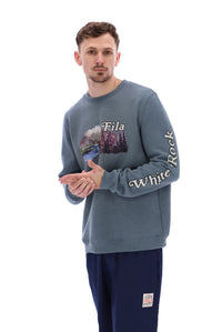 Displays a model wearing the Stormy Weather 'FILA' branded Len Graphic Crew Sweatshirt