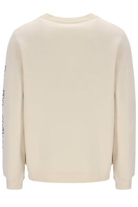 Beige FILA Sweatshirt with black trousers and bottoms.