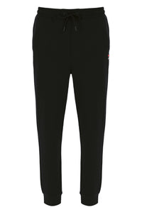 A pair of black Lonny Drawstring Joggers by FILA, featuring an elasticated waistband, cuffed ankles, and a branded FILA logo.