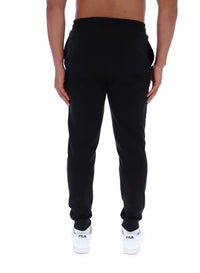 Black sweatpants worn by a person on a white background