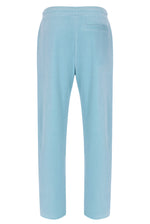 Light blue velour pants on a white background