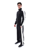 Person wearing a black and white tracksuit on a white background