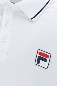 A white tennis polo shirt with button-up fastening and cap sleeve. It features the FILA logo and a small GB flag on the chest.