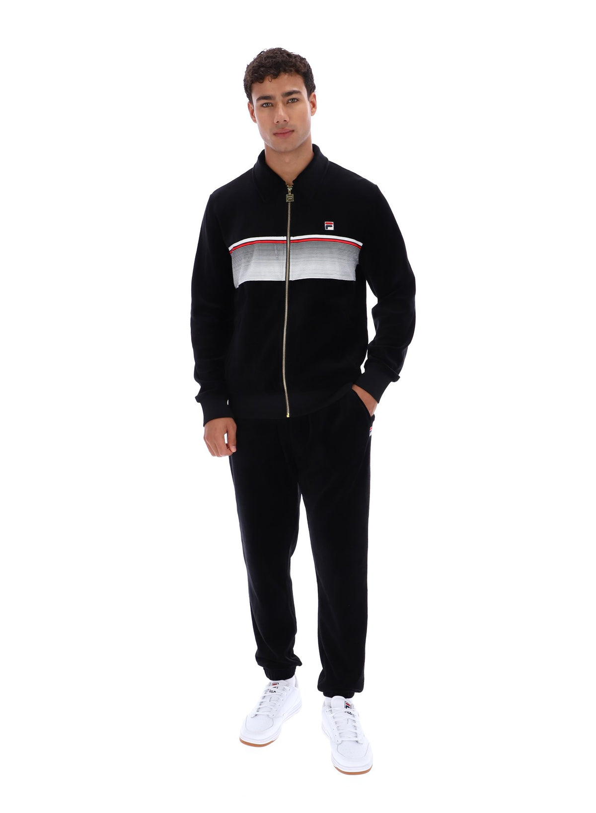 Displays a model wearing the Black 'FILA' branded Malakai Striped Track Top