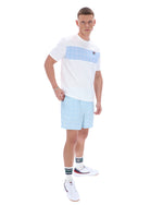 Man wearing a white and light blue striped t-shirt and shorts on a white background