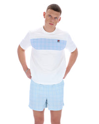 Man wearing a white t-shirt with a blue pocket and light blue shorts on a white background