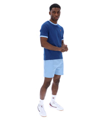 Displays a model wearing the Limoges 'FILA' branded Marconi Essential Ringer T-Shirt