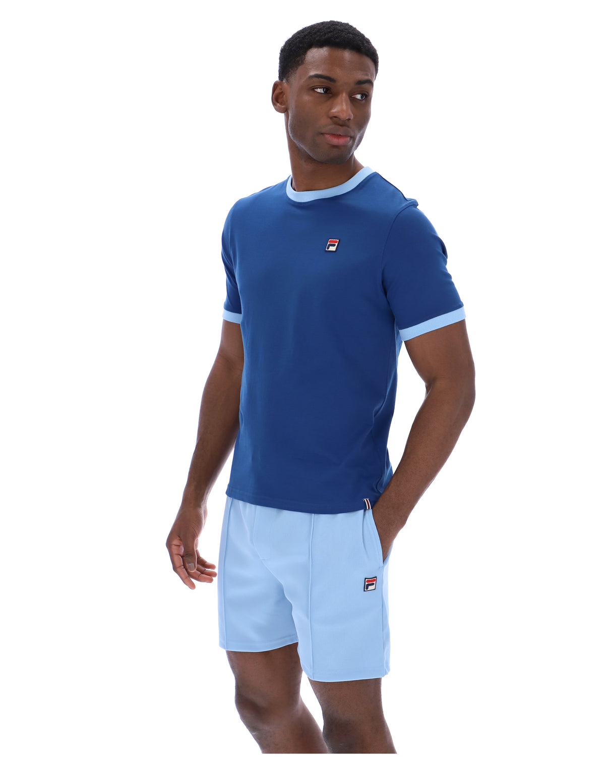 Displays a model wearing the Limoges 'FILA' branded Marconi Essential Ringer T-Shirt