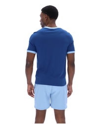 Displays a model wearing the Limoges 'FILA' branded Marconi Essential Ringer T-Shirt