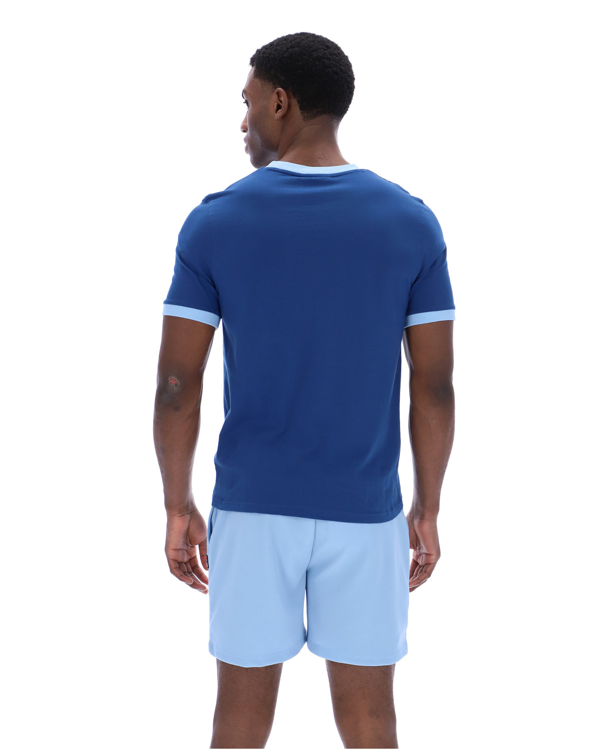 Displays a model wearing the Limoges 'FILA' branded Marconi Essential Ringer T-Shirt