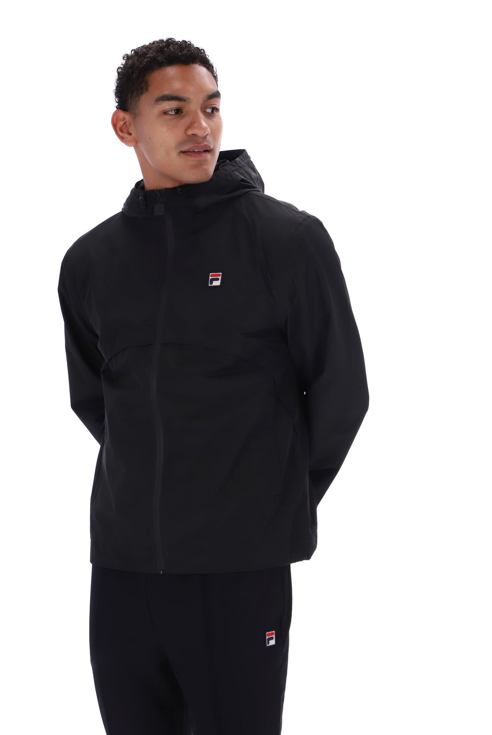 Displays a model wearing the Black 'FILA' branded Marcos Full Zip Jacket