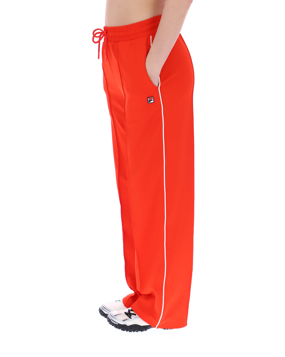Orange sweatpants with white trim and a small FILA logo on a white background