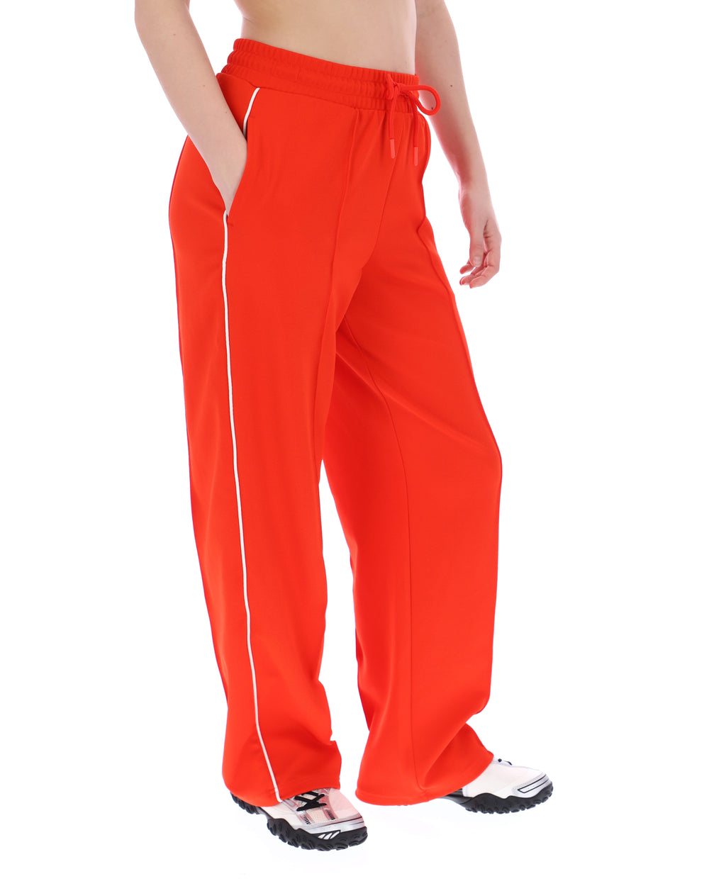 Orange sweatpants with white trim on a white background
