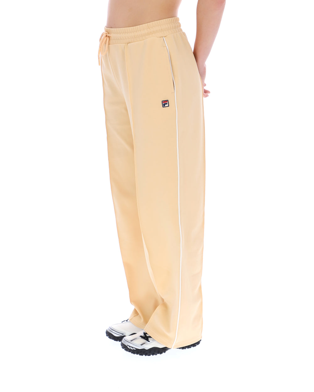Beige sweatpants with a brand logo on a white background