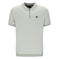 Light green polo shirt with a brand logo on a white background