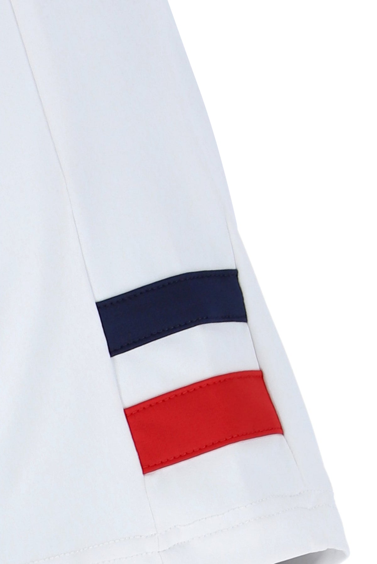 White tennis t-shirt with cap sleeves, featuring the FILA logo and a Union Jack flag patch on the chest.