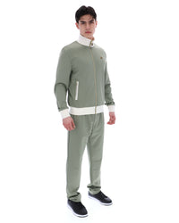 Displays a model wearing the Sea Foam 'FILA' branded Mathers Herringbone Track Top